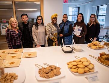 iCapital employees enjoy a potluck featuring foods from different cultures